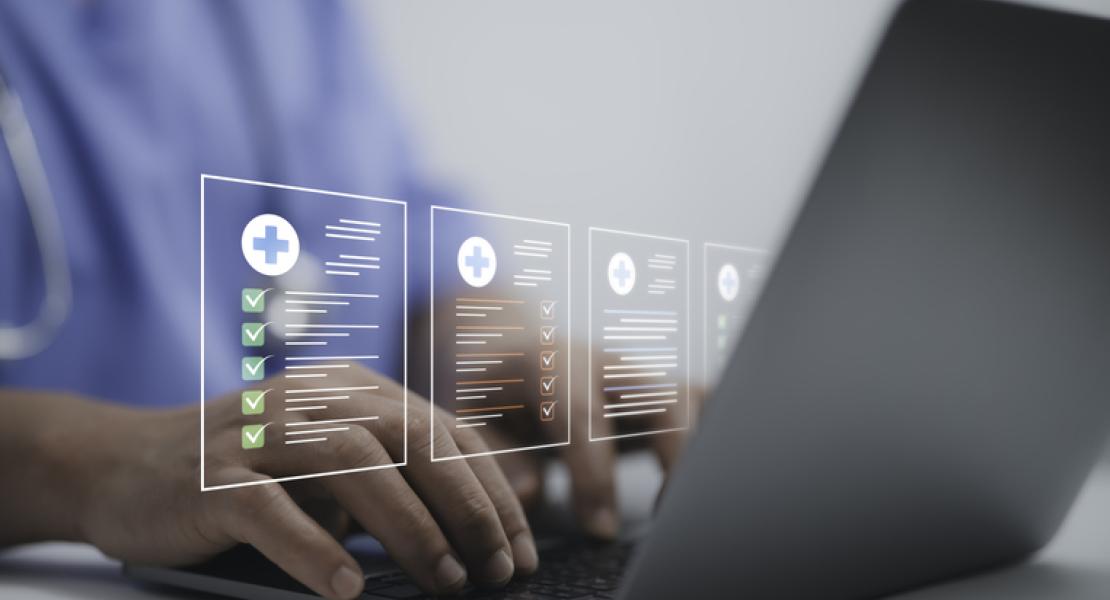 A person in a medical uniform with a stethoscope around their neck is typing on a laptop, with holographic medical checklists and checkmarks displayed above the keyboard.