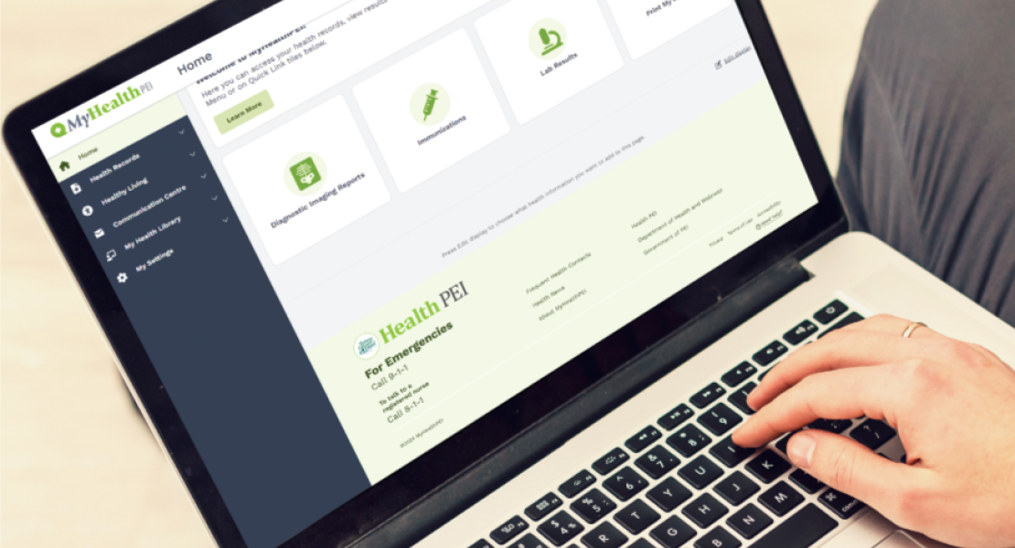 Person using a laptop with the MyHealth PEI website open