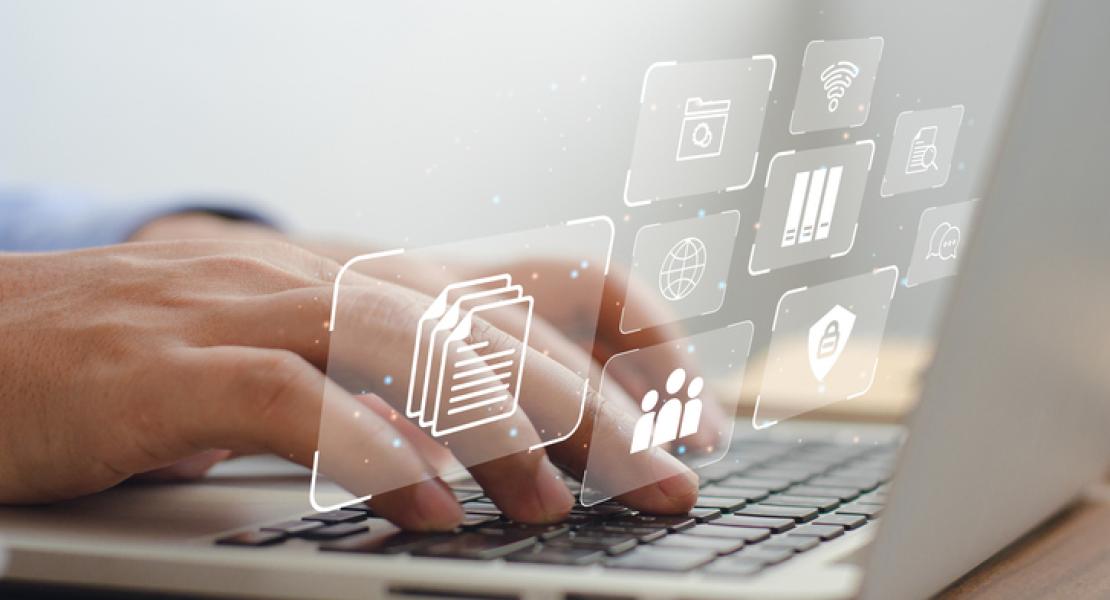 Person typing on a laptop with floating digital screens displaying medical symbols and checklists, representing digital health records or medical data management.